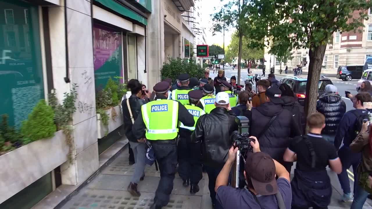 Police Intervene as UKIP Protesters Pursue Masked Individual in London