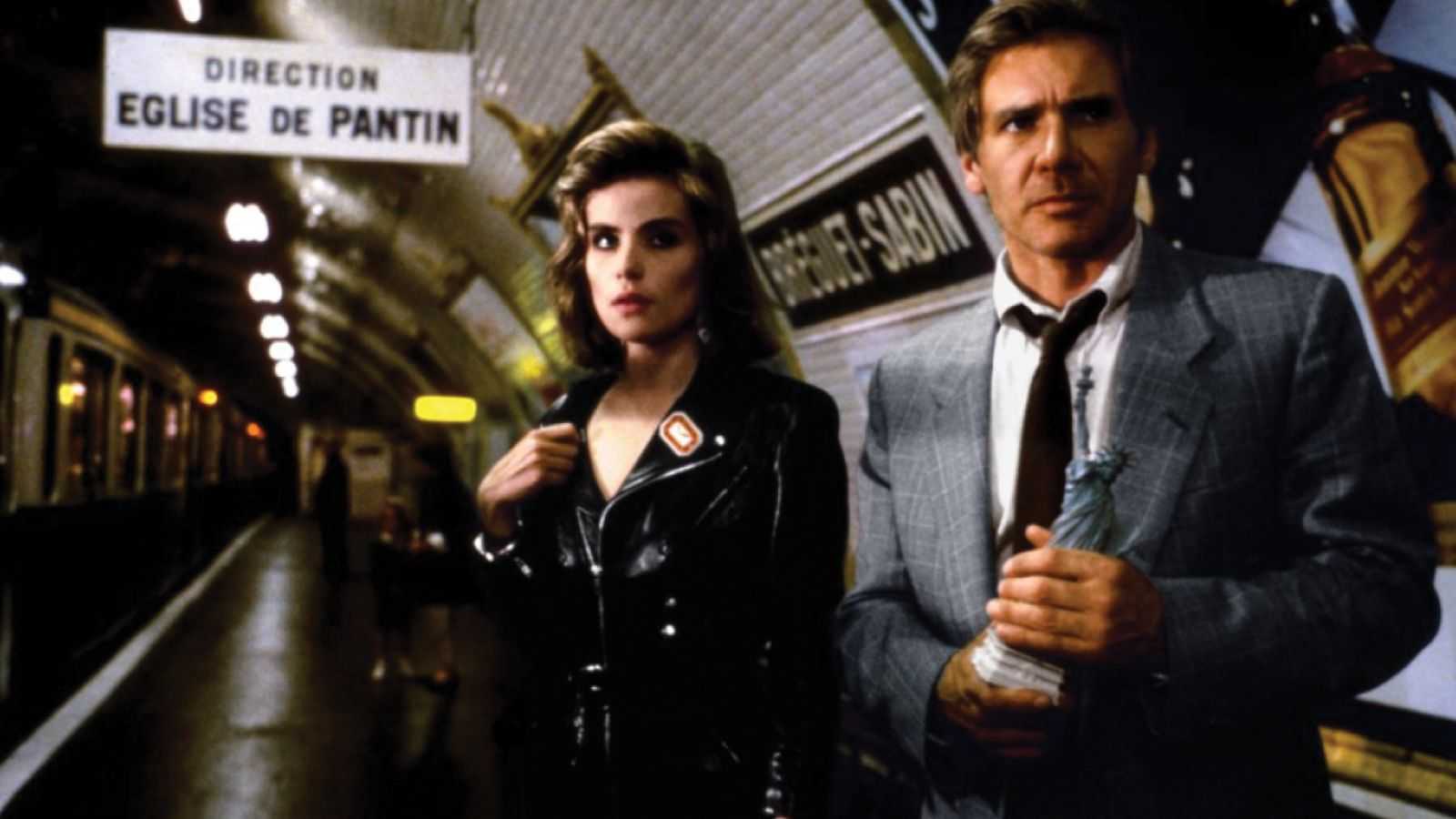 Richard Walker and Michelle standing in a train station in Frantic 1988