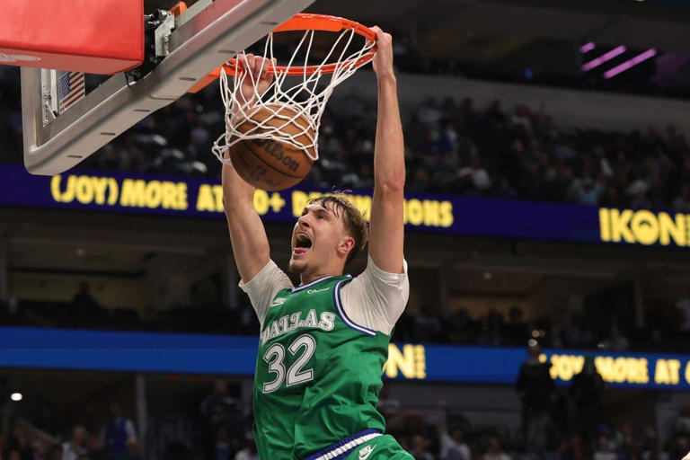 Cooper Flagg #32 of the Dallas Mavericks dunks against the Toronto Raptors during the second half at American Airlines Center in Dallas, Texas.