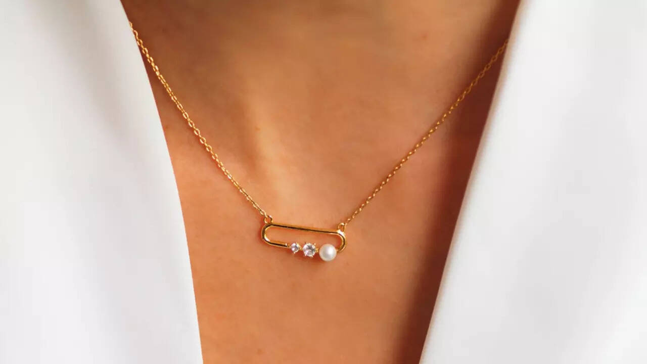 Why is everyone suddenly wearing safety pin pendant necklaces?