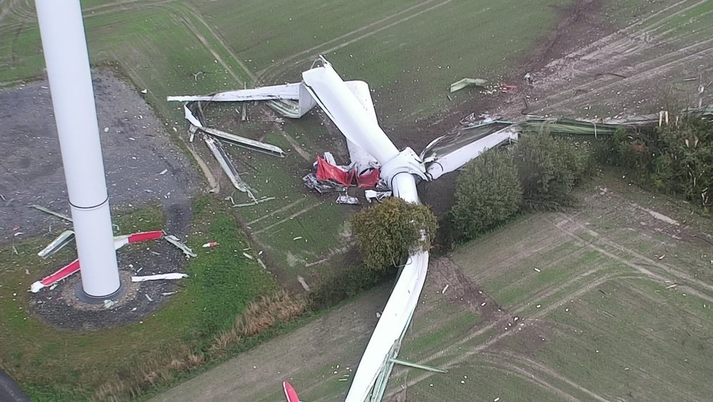 Wind turbine breaks off and crashes onto field
