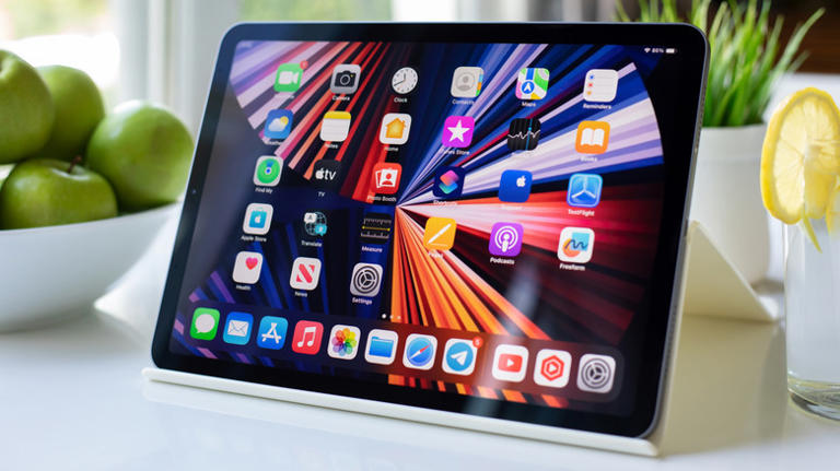 iPad tablet showing home screen with apps