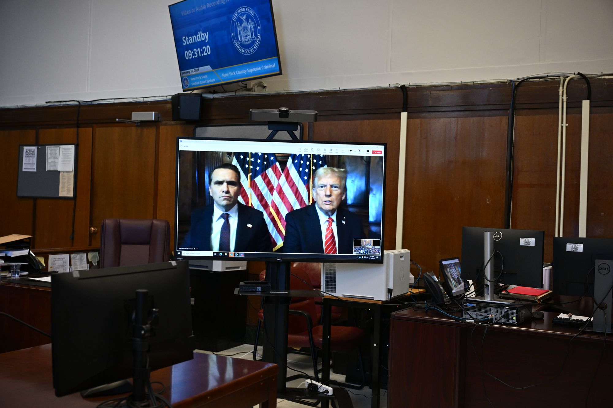Days before he was sworn into office, Trump appeared virtually in a Manhattan criminal courtroom to receive a sentence of ‘conditional discharge,’ which preserved his felony convictions without little other consequences (Getty Images)
