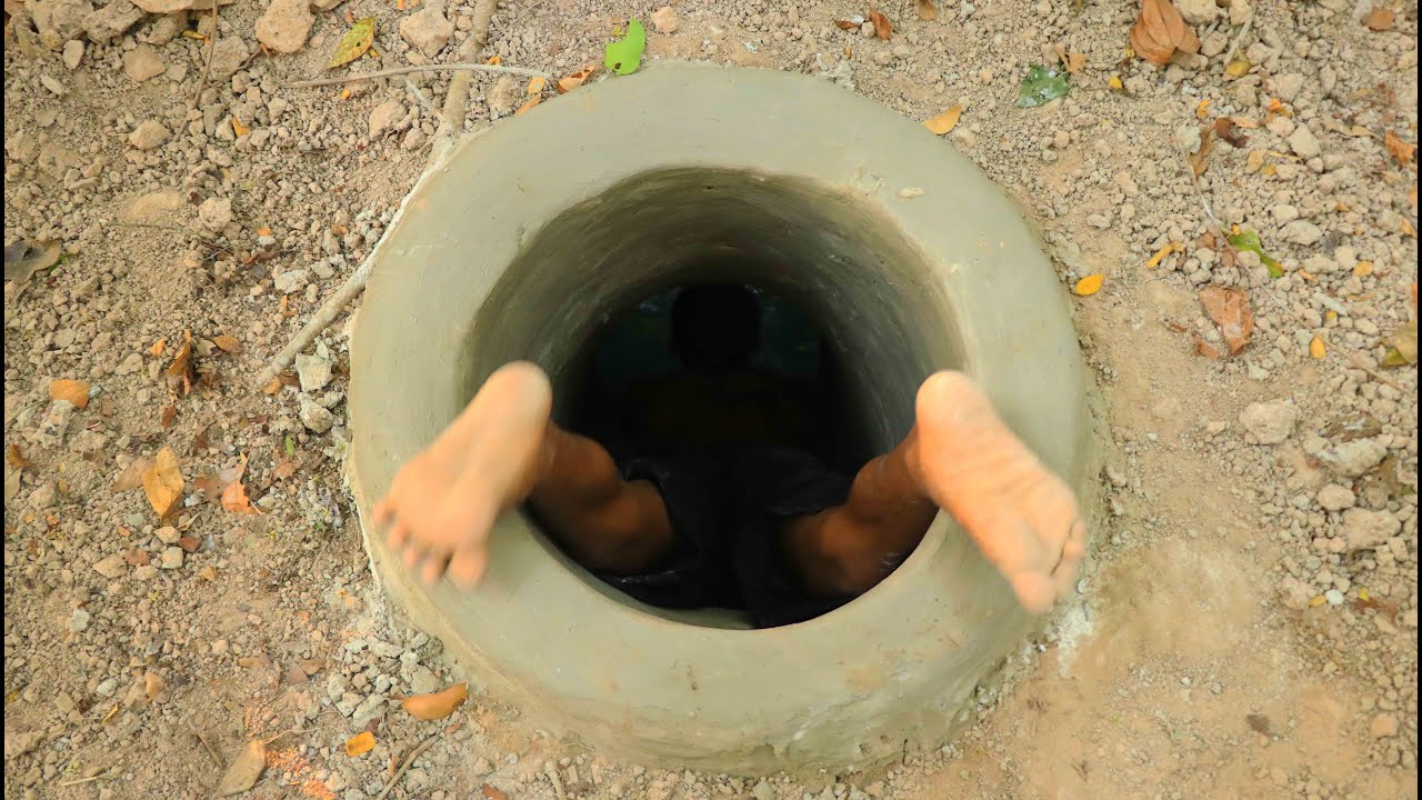 Builders make an underground pool with a water slide