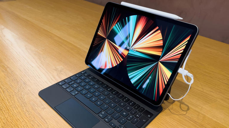 iPad with charging cable plugged in