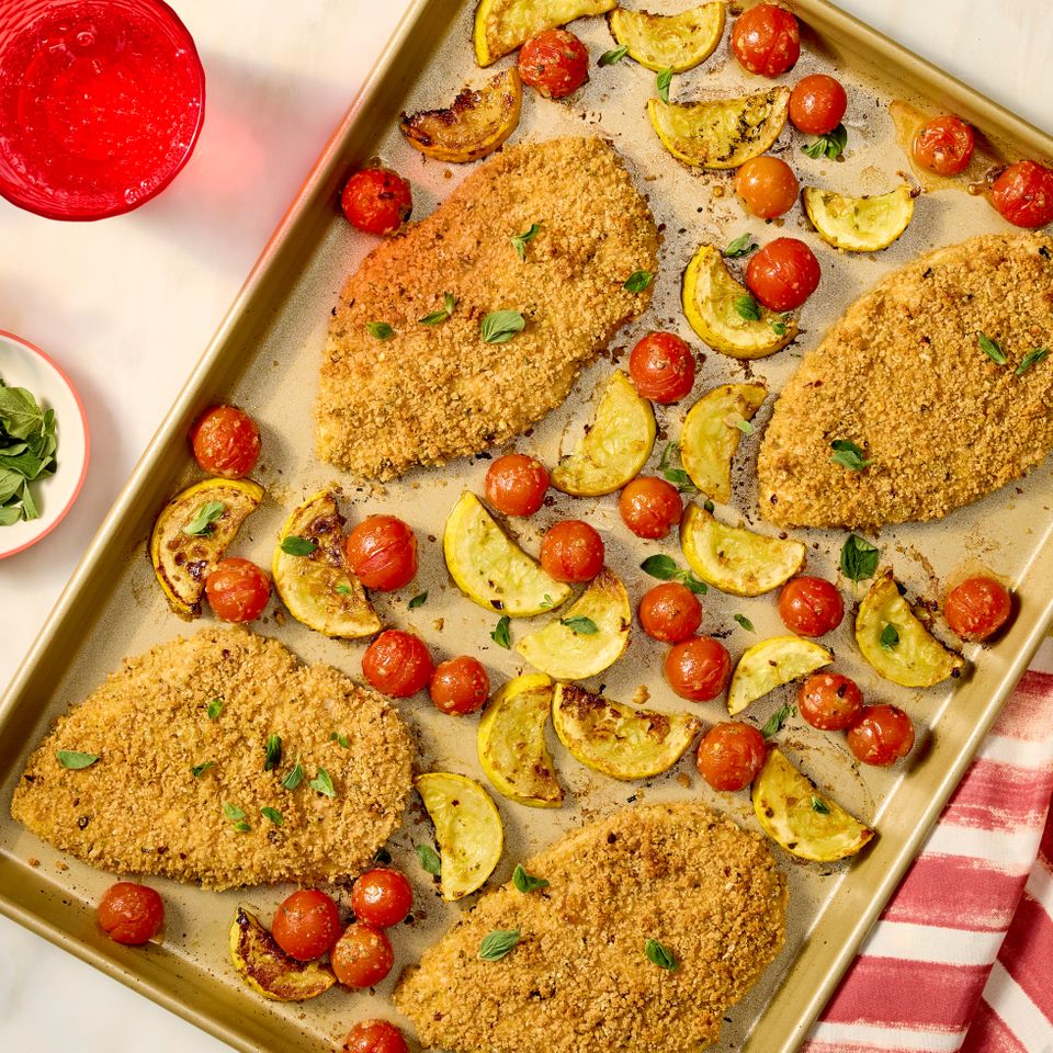 a recipe photo of Sheet-Pan Crispy Chicken with Squash & Tomatoes