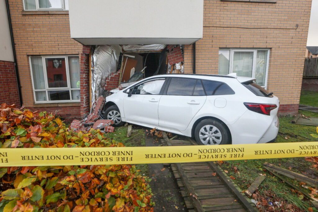 Car crashes into house on busy residential street