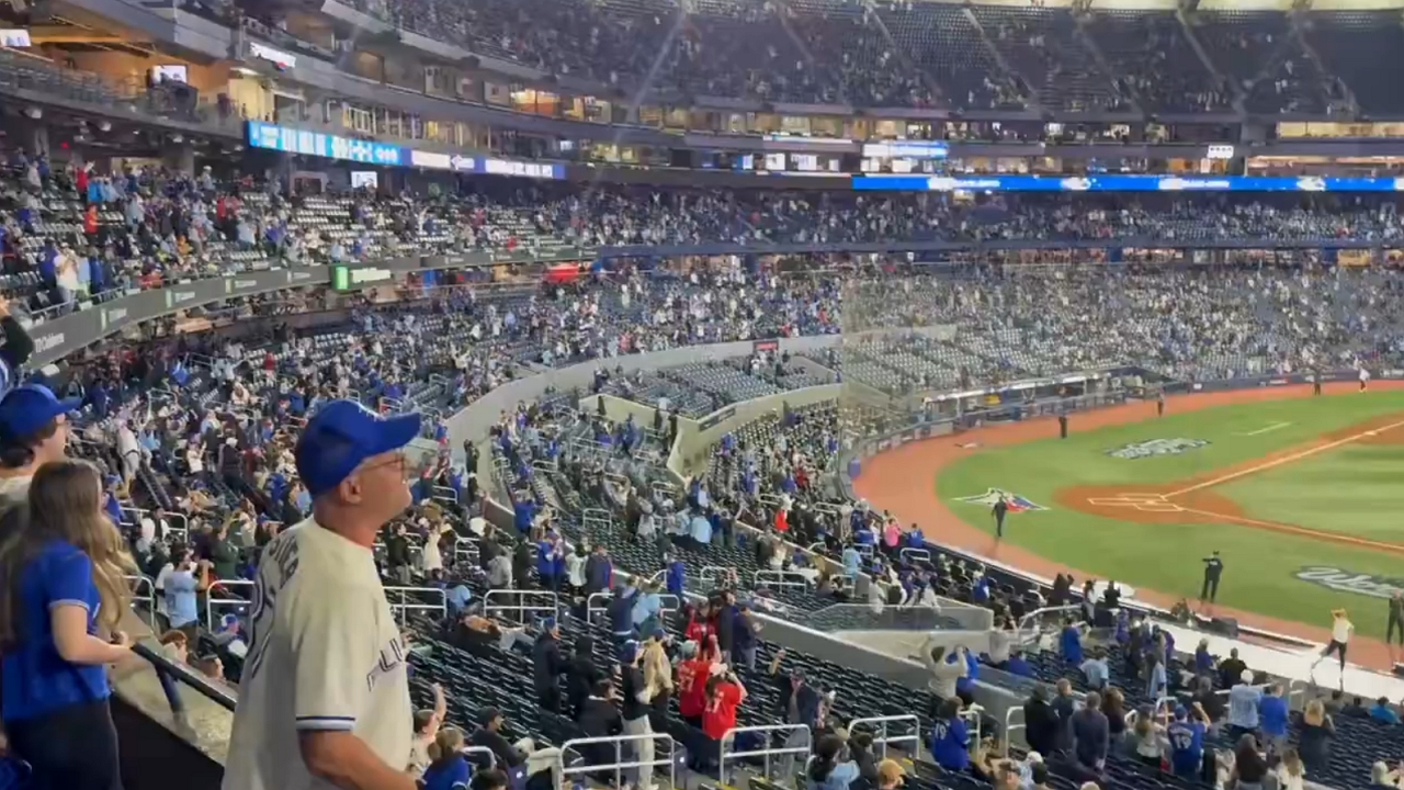 Fans chant during marathon World Series Game 3 in Toronto, Canada