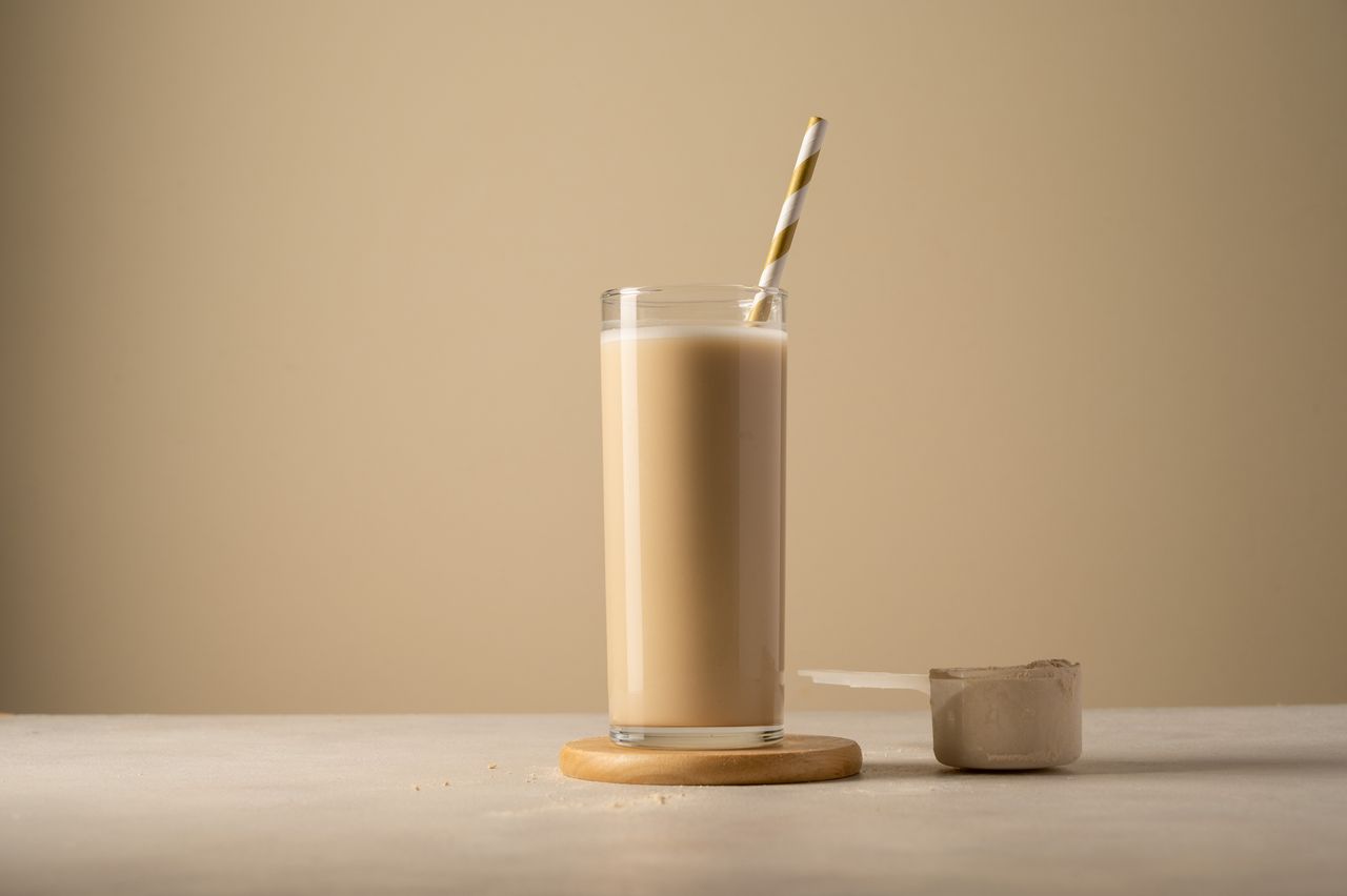 Protein powder and drink in a glass.