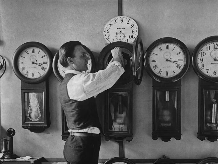 A man repairing one of the many clocks at the US Treasury in Washington D.C. circa 1930. (Photo by Keystone View/FPG/Getty Images)