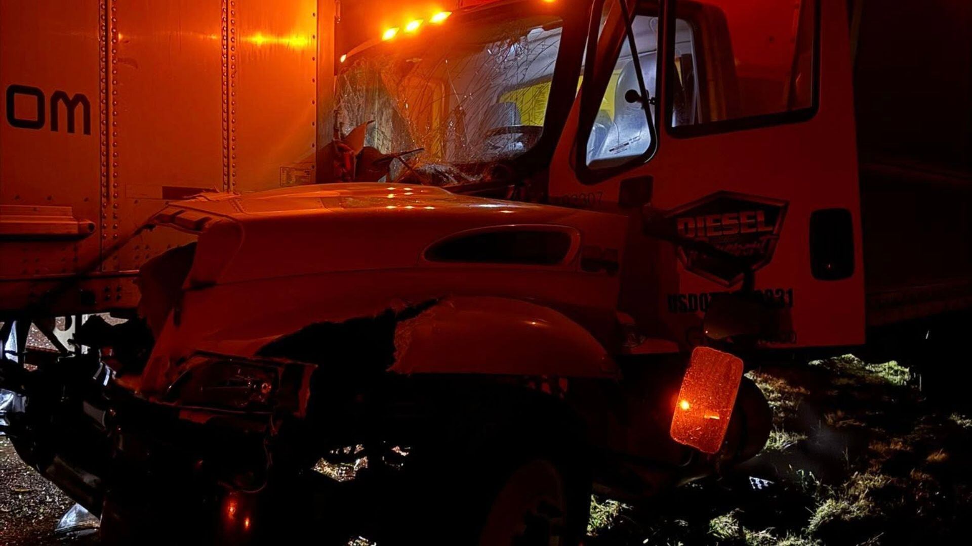 Minor injuries reported after box truck crashes into parked tractor ...