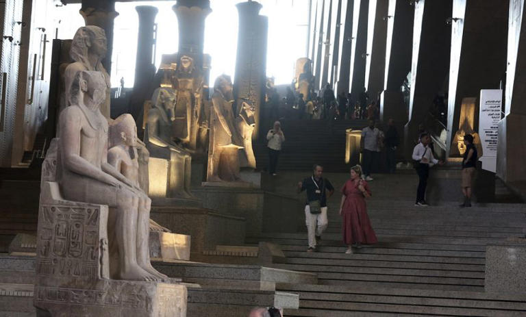 Visitors will enter the museum via the Grand Hall and Grand Staircase, vast spaces that house towering hieroglyphed columns and colossal statues of pharaohs. Khaled Elfiqi/Copyright 2024 The AP. All rights reserved