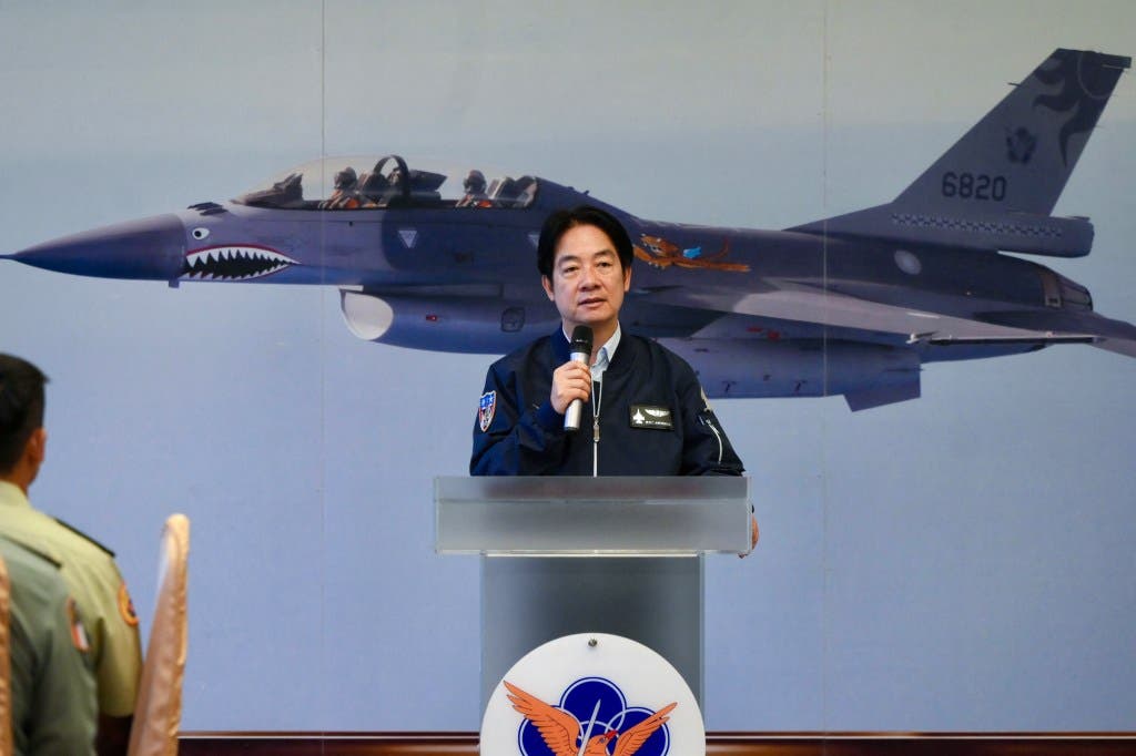 Taiwanese President Lai Ching-te speaks to military personnel at an air force base in Hualien on May 28, 2024, with a Taiwanese F-16 fighter jet in the backdrop.