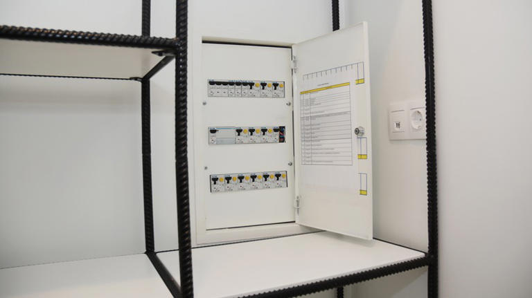 The Clever Design Trick That Hides The Eyesore Of Electrical Panels In ...