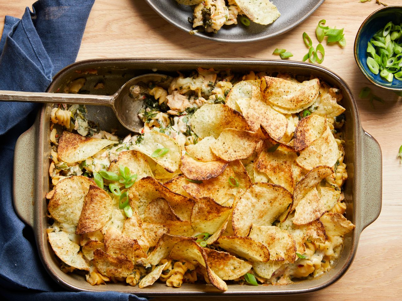 a top down view of a tuna noodle casserole topped with crispy, golden-brown potato chips