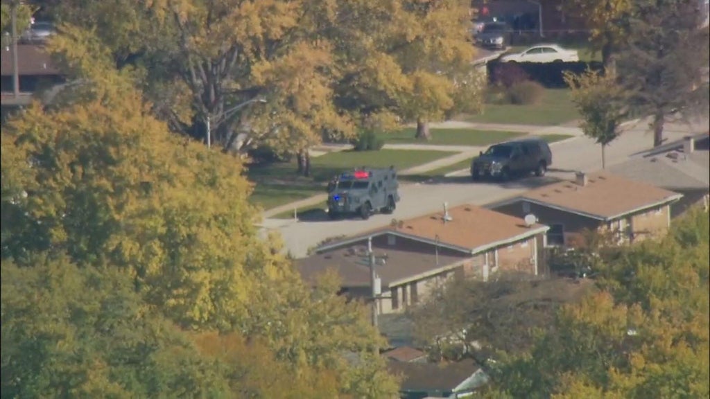 Suspect in custody after firing shots at police during standoff in ...