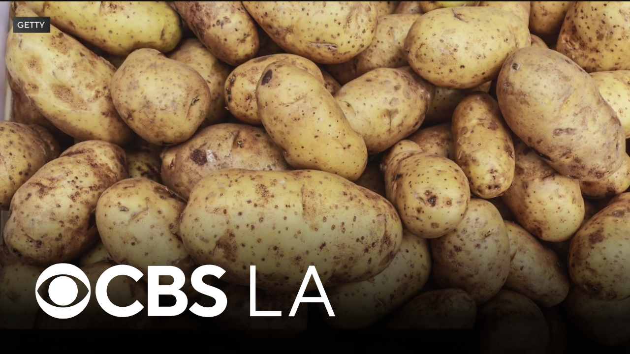 LA County woman handing out potatoes for Halloween