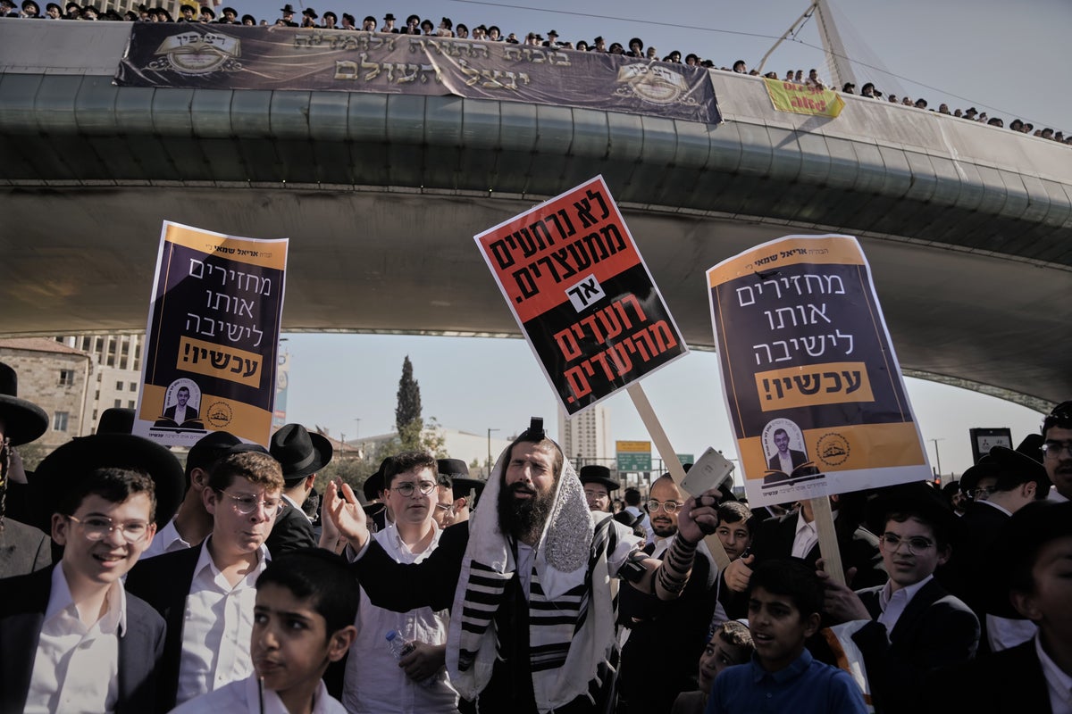 Water cannons fired as Orthodox Jews protest Israel military draft