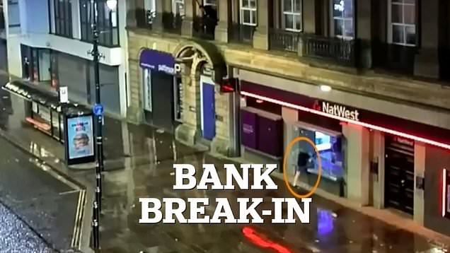 Moment bathroom fitter smashes into bank with scaffolding pole