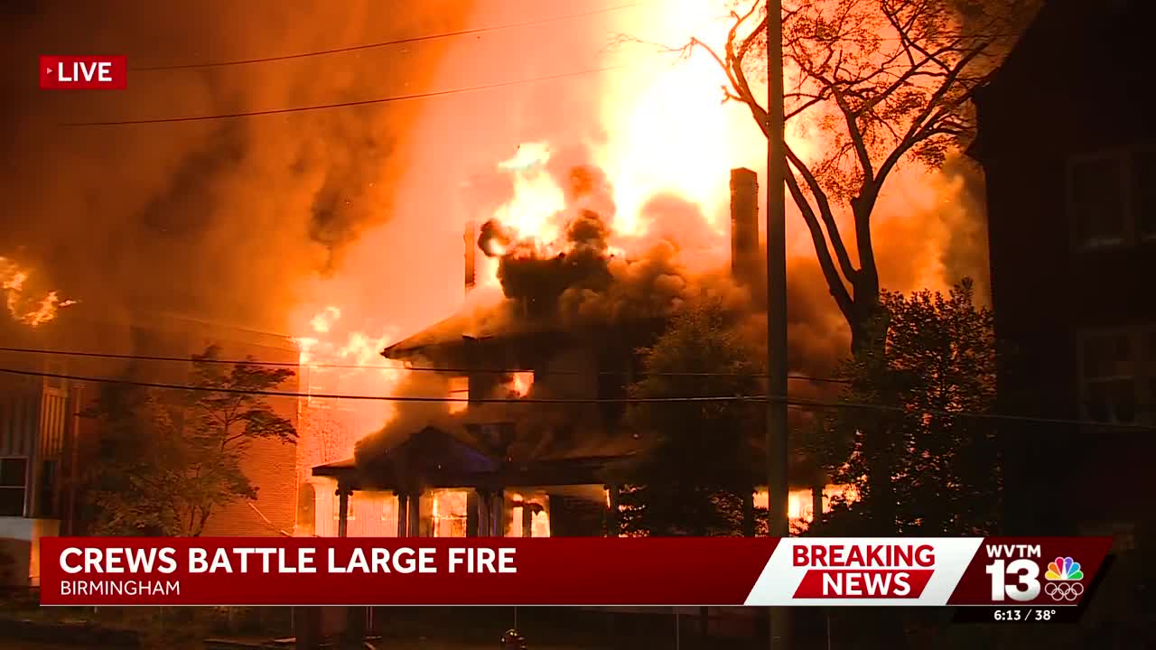 Firefighters battle large fire at businesses and apartments in ...