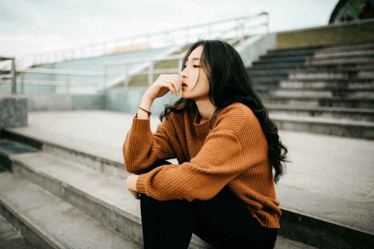 8 Subtle Signs a Woman Has Been Through 'A Lot,' According to Psychology