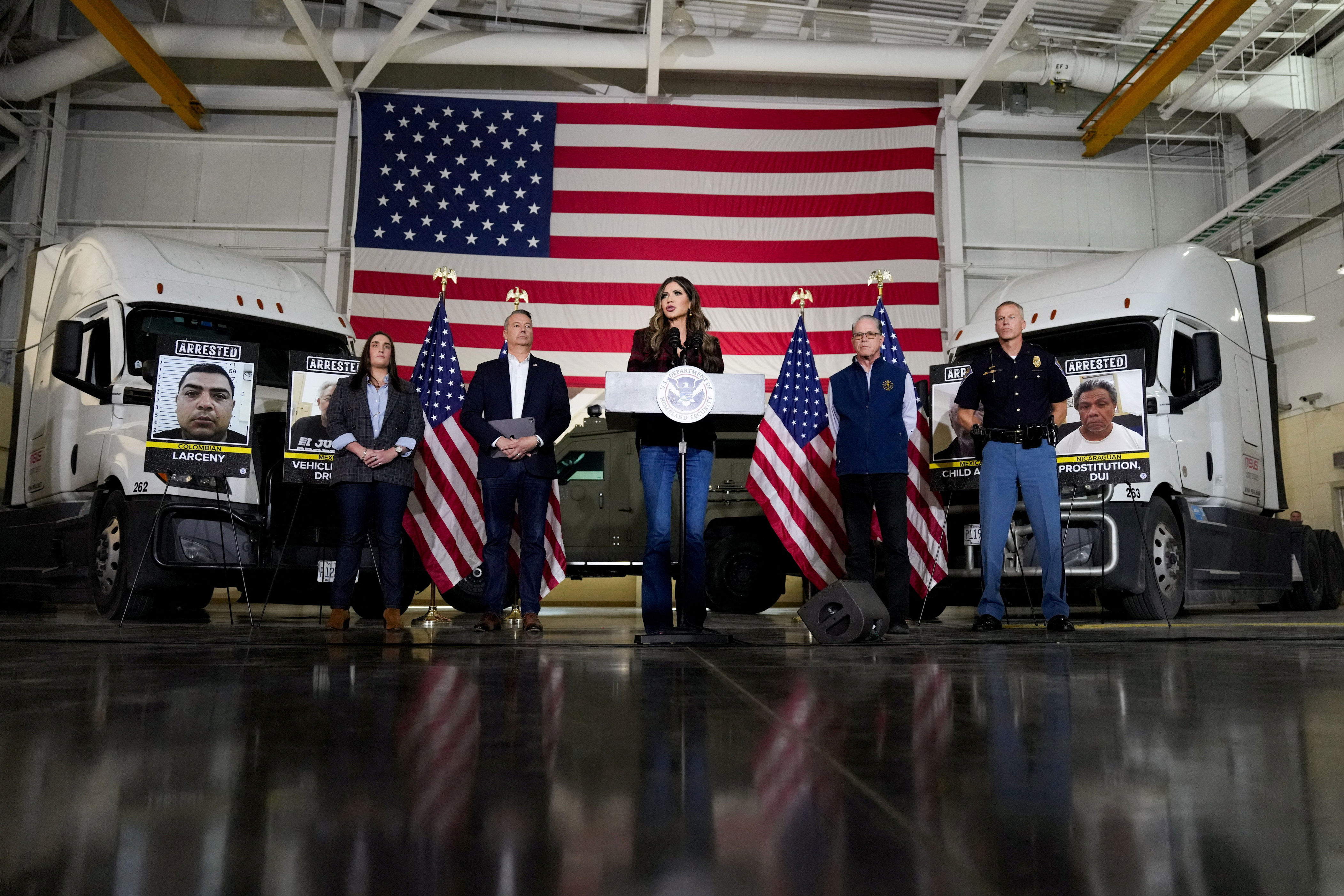Noem, standing in front of two large trucks, announced 146 truck drivers were arrested in Indiana, claiming that the drivers had ‘overwhelmingly’ received licenses from California, New York and Illinois (REUTERS)