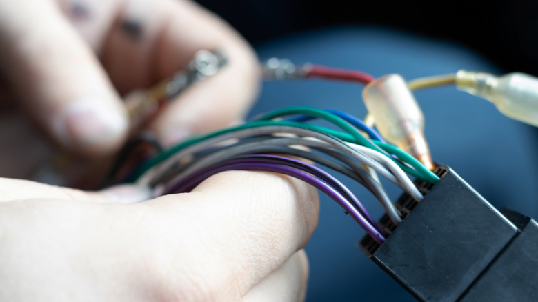 Wires leading out of a rectangular plug.