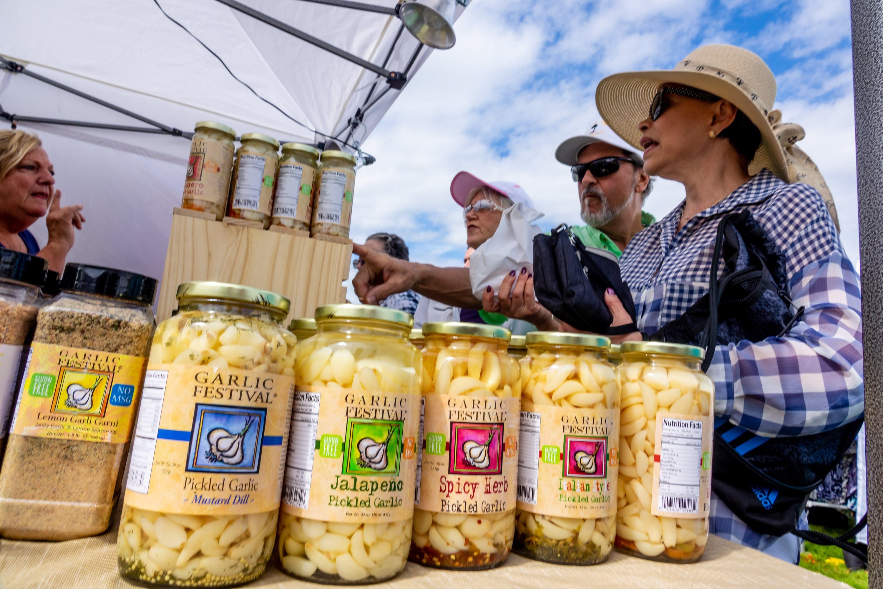 Pat West, from Gilroy, CA, sells her garlic products during the South Florida Garlic Fest Saturday inside John Prince Park in Lake Worth Beach on February 8, 2020.