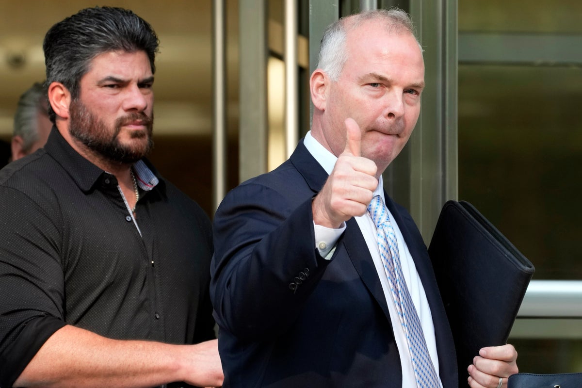Trump pardons ex-cop convicted of helping China stalk an expat