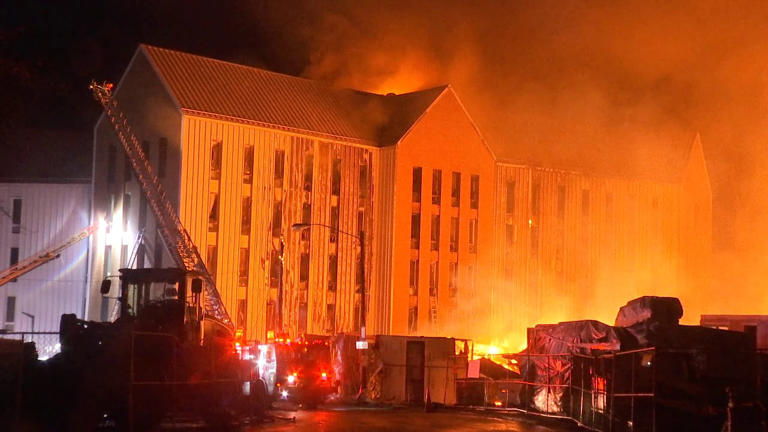 More than 200 displaced after huge fire destroys buildings at Mass ...