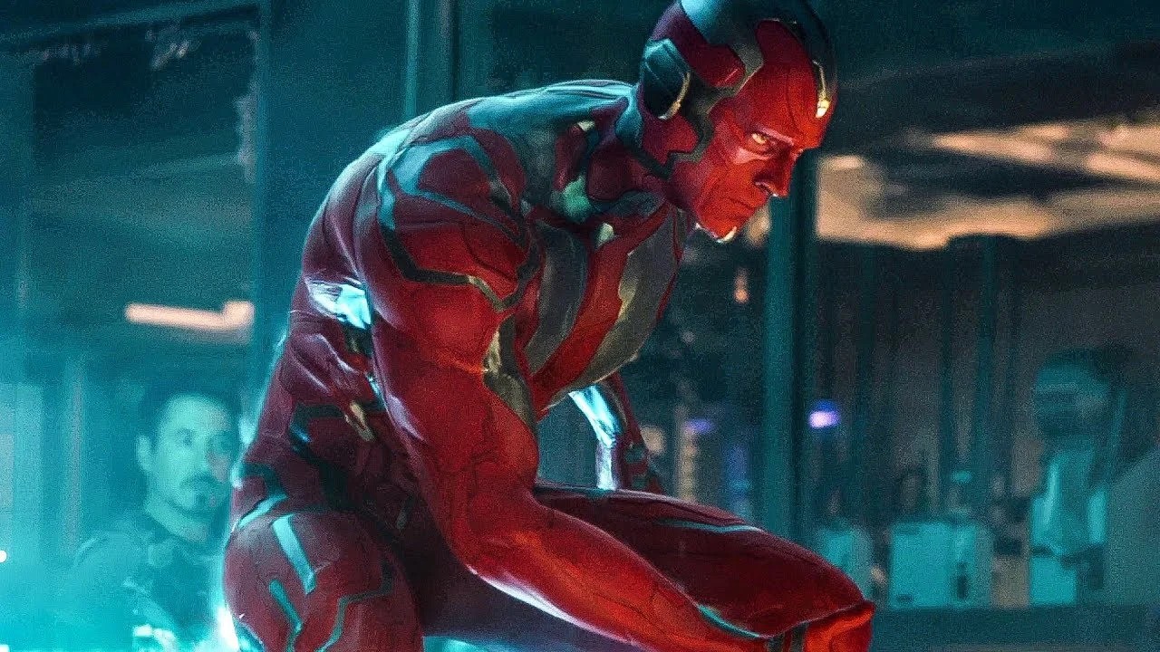 Vision crouched down and glaring after being born in Avengers: Age of Ultron