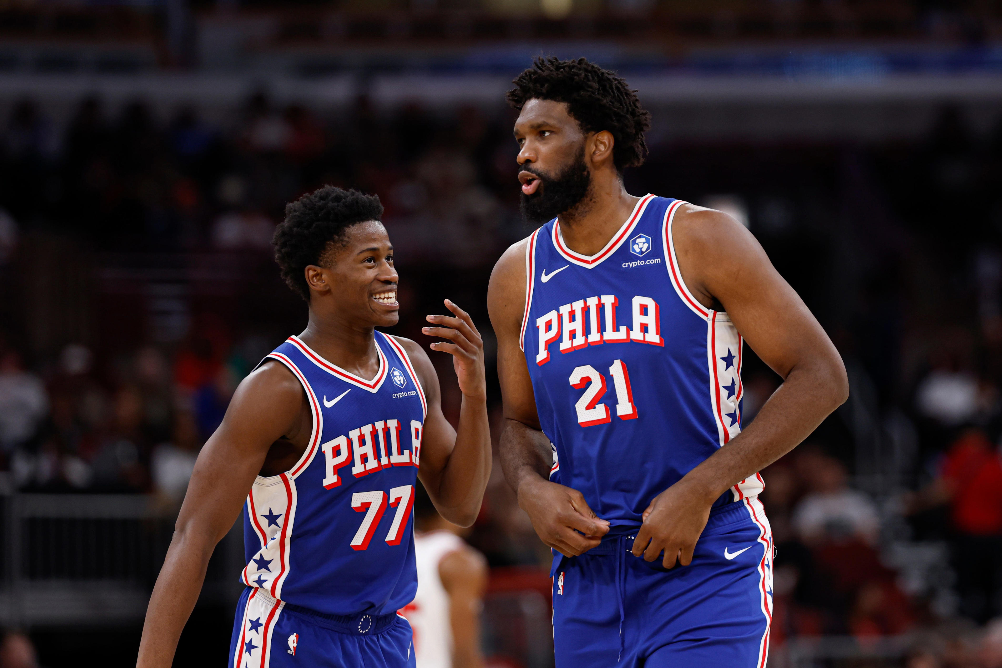 Nov 4, 2025; Chicago, Illinois, USA; Philadelphia 76ers guard VJ Edgecombe (77) chats with center Joel Embiid (21) during the first half of an NBA game against the Chicago Bulls at United Center. Mandatory Credit: Kamil Krzaczynski-Imagn Images