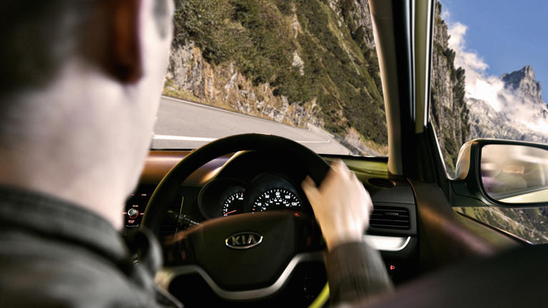 Motorist sets new world record for driving on two wheels in rental car