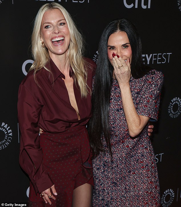 The Hollywood actress, 62, put on a leggy display in a black and red minidress which boasted short sleeves as she hugged Ali, 49, from behind