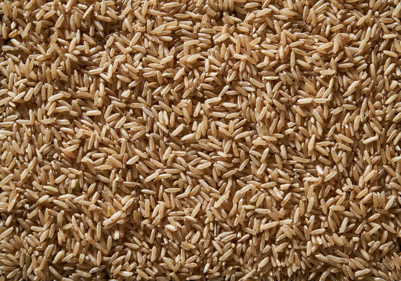 Raw whole brown rice close up.