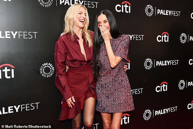 The duo were spotted whispering in each others ears before larking around at the premiere