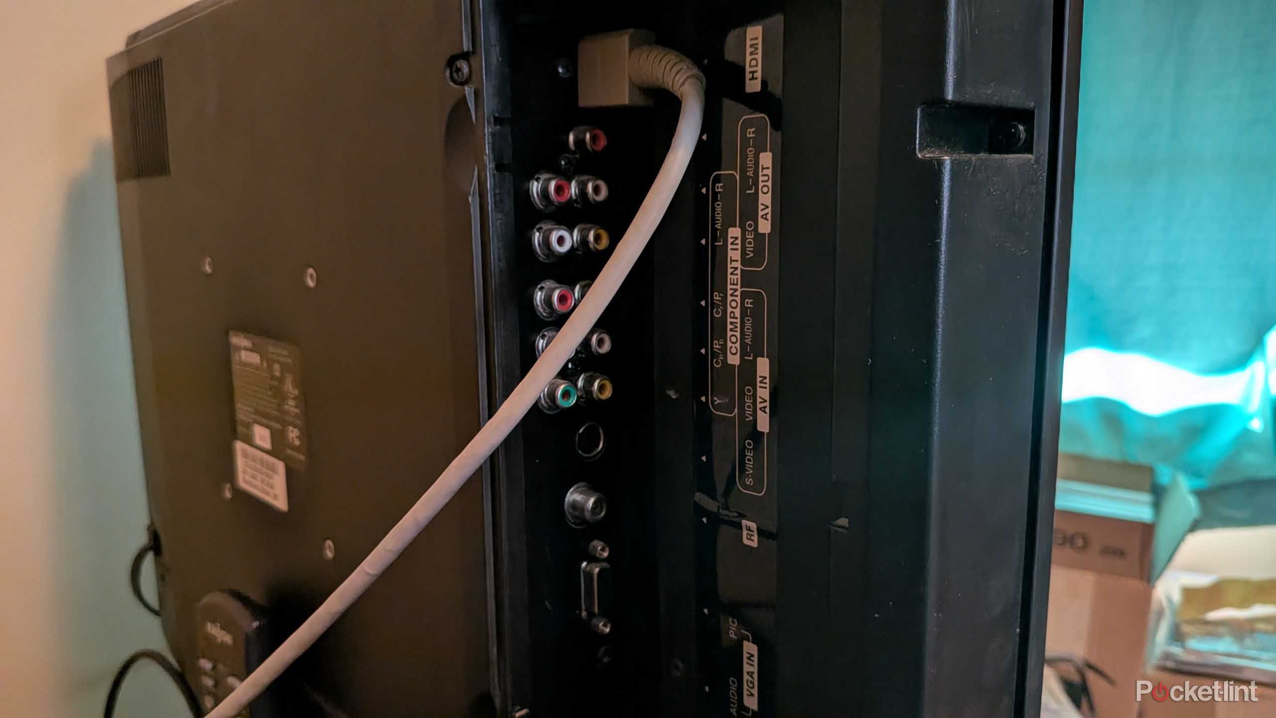 An HDMI cable plugged into an Insignia TV.