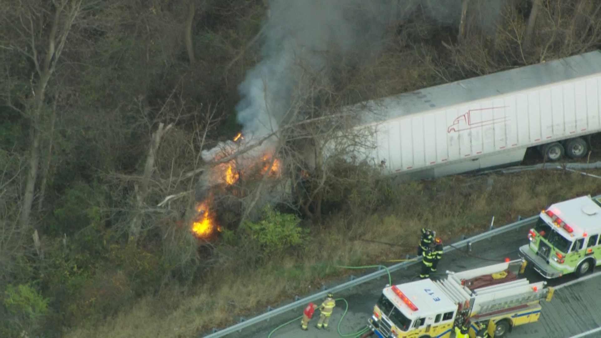 Tractor-trailer crashes off road, catches fire in Fayette County
