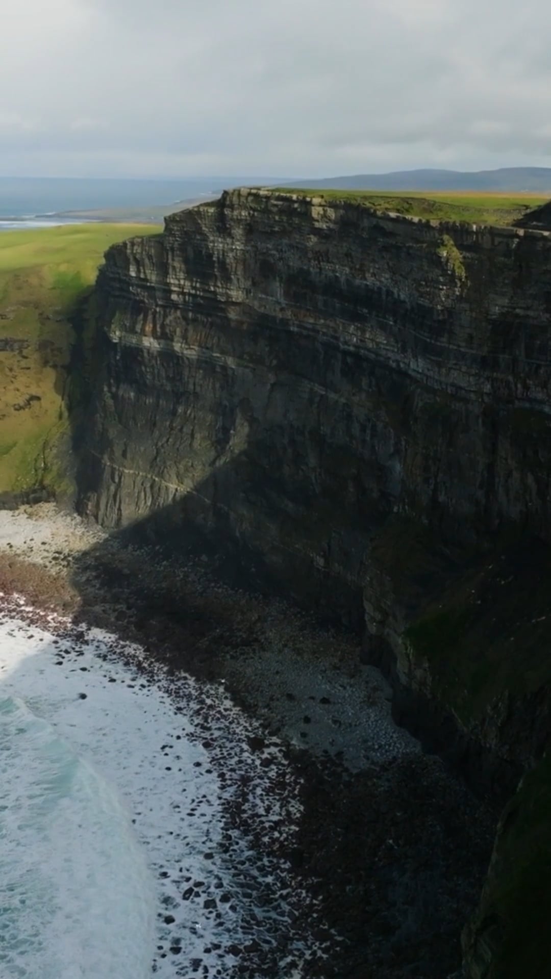 Enchanting Aerial Tour: Ireland's Lush Fields and Ancient Ruins.