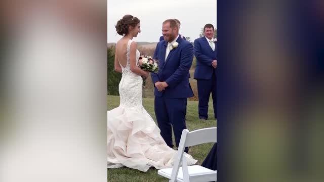 Viral moment as groom covers his cold bride with his suit jacket at ...