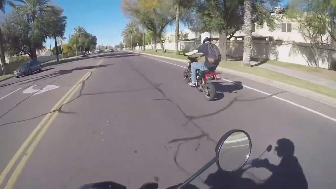 Skilled motorcycle rider performs impressive one-wheel balancing tricks ...