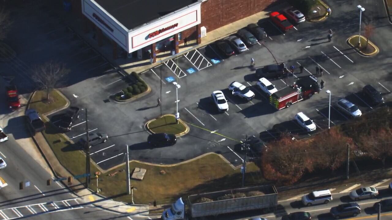 Woman shot in head at CVS dies; person of interest in custody