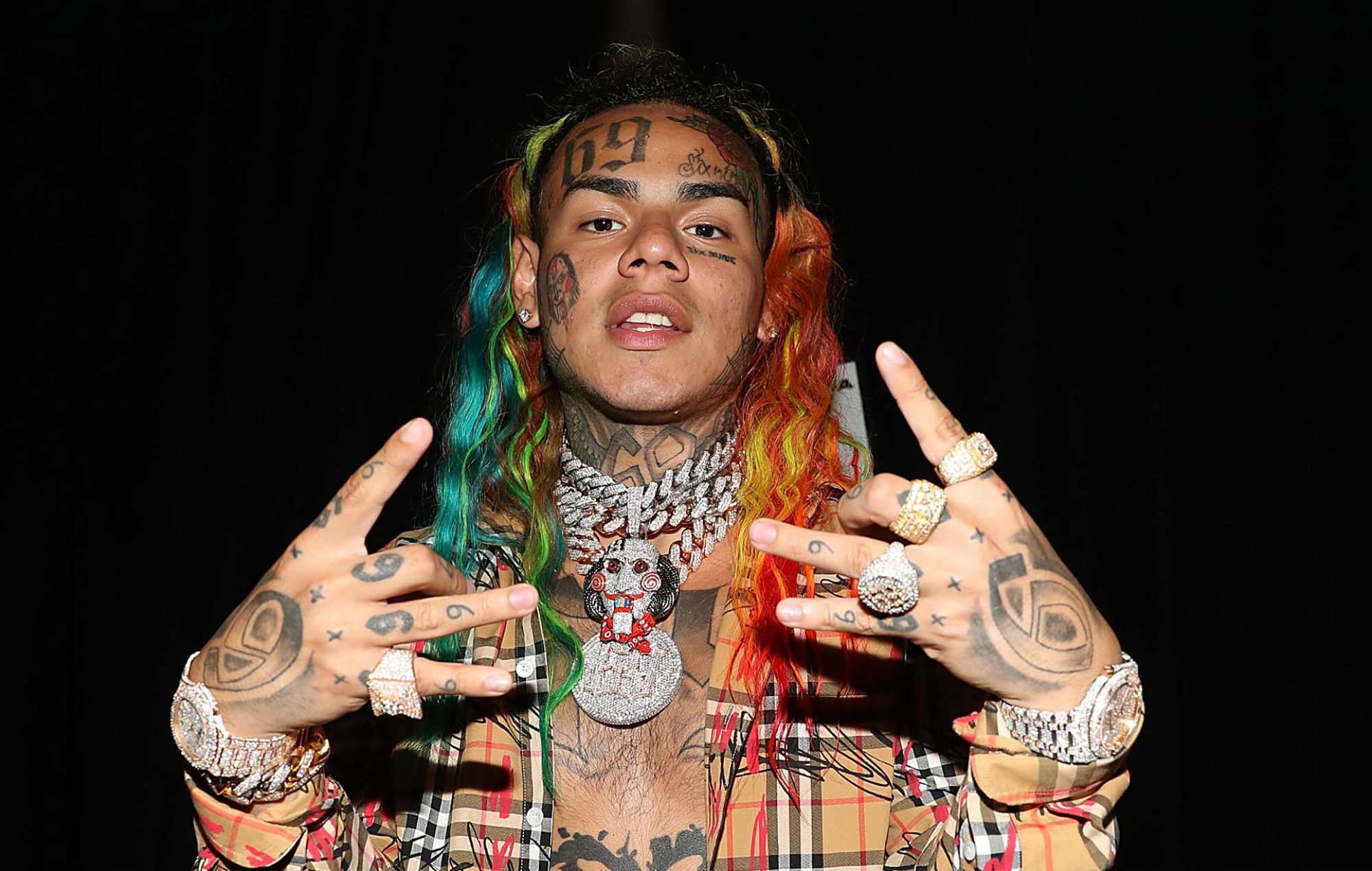 Rapper 6ix9ine leaves jail, flaunts SpongeBob plush signed by Nicolás ...
