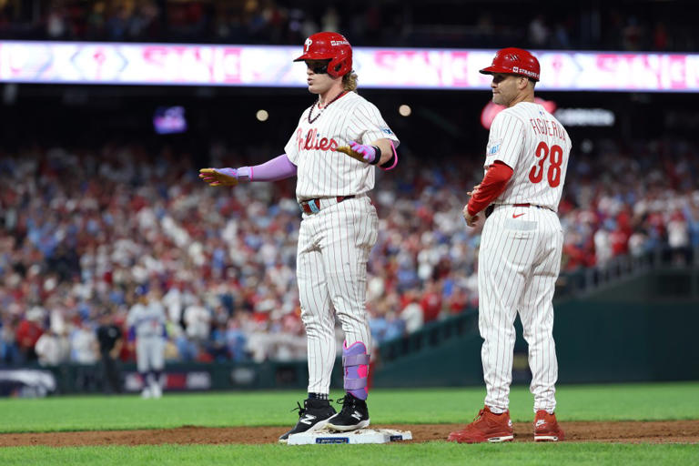 PHILADELPHIA, PENNSYLVANIA – OCTOBER 06: Harrison Bader #2 of the Philadelphia Phillies celebrates after hitting a single during the ninth inning against the Los Angeles Dodgers in game two of the National League Division Series at Citizens Bank Park on October 06, 2025 in Philadelphia, Pennsylvania. (Photo by Emilee Chinn/Getty Images)