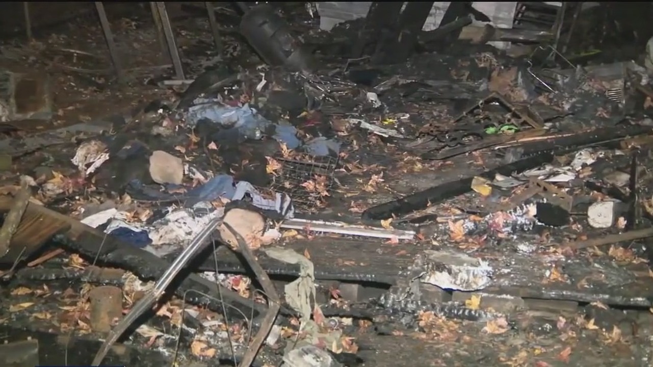 Woman inside building set ablaze; man arrested