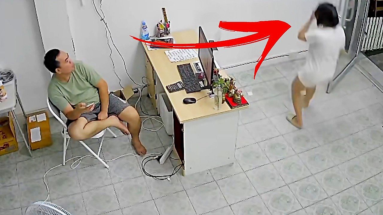 Woman walks into wall while texting in thailand