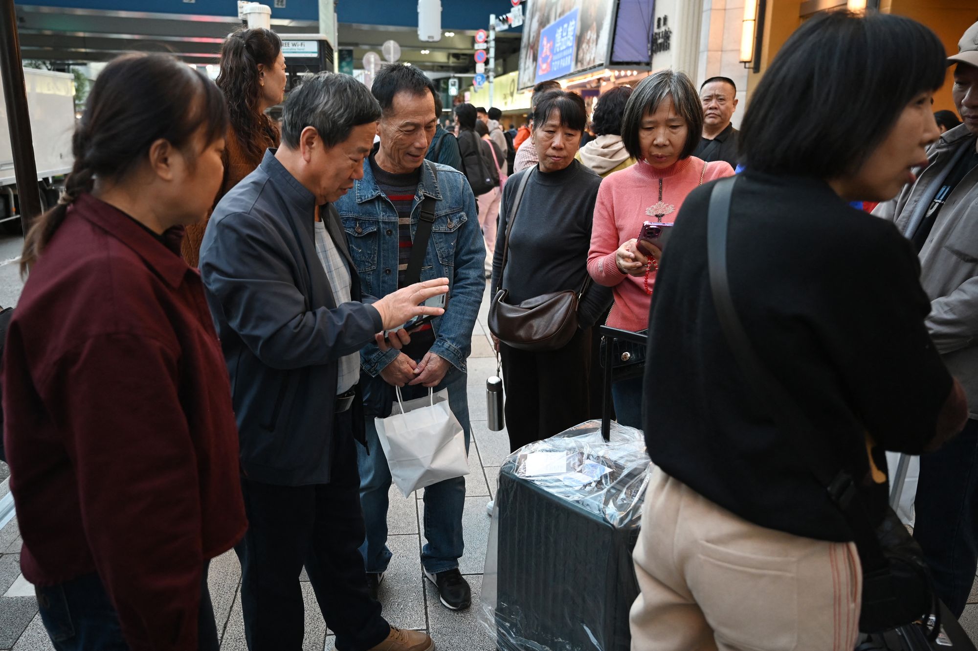Japan warns citizens in China to stay alert as diplomatic row deepens
