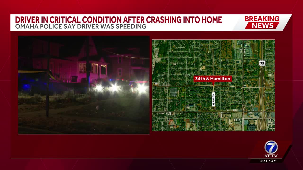 One critically injured after crash into house