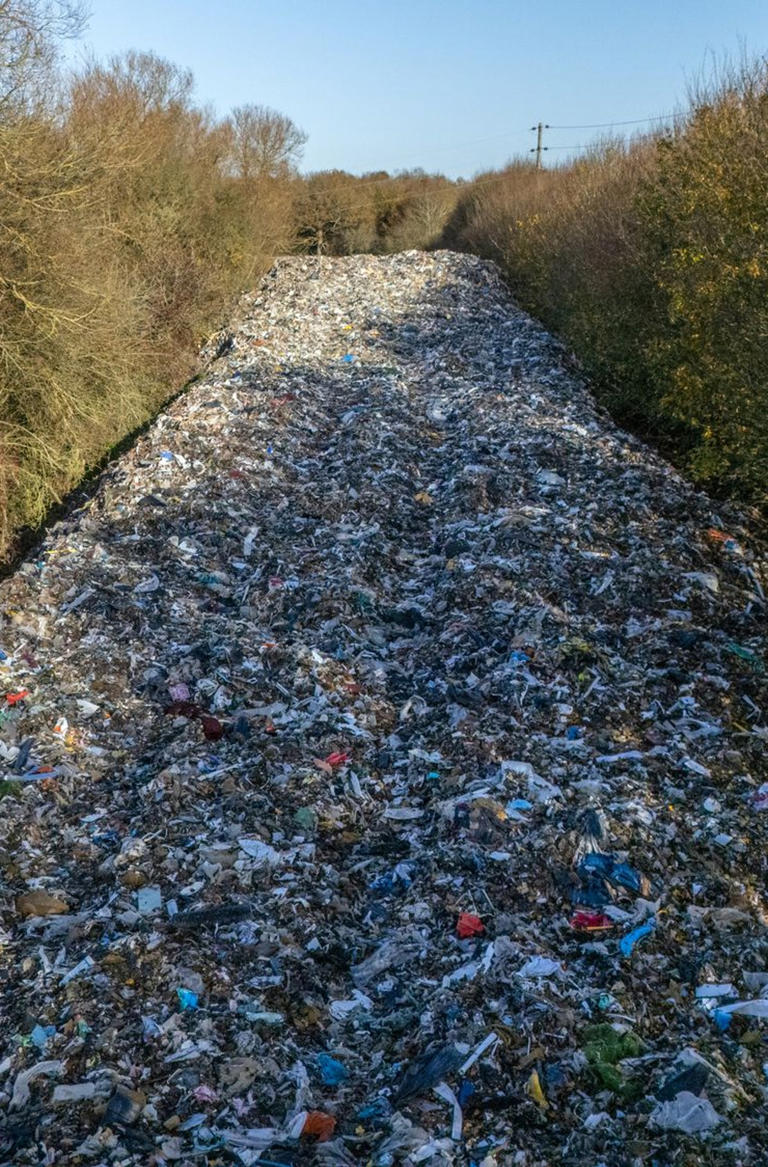 Fears as ‘obscene’ fly-tipped rubbish dump drifts closer to river