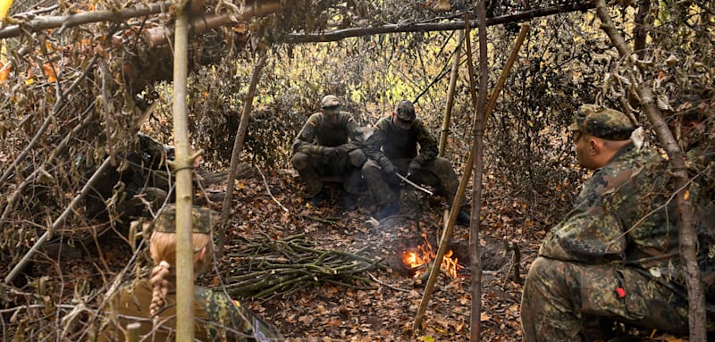 Recruits attend a tank destruction exercise in the field at the Westfalen-Kaserne barracks of the German armed forces (Bundeswehr) in Ahlen, western Germany, during a media day about the basic training for Bundeswehr recuits, on November 13, 2025. Germany's coalition government has agreed a new voluntary military service model, politicians said on November 13, 2025, after weeks of wrangling over whether there should be a compulsory element. From the year 2026, all 18-year-old men will have to fill in a questionnaire on whether they would want to serve and undergo an armed forces physical test, if the plan is adopted. (Photo by Ina FASSBENDER / AFP)